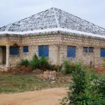 Completed metal truss system with insulated roof panels